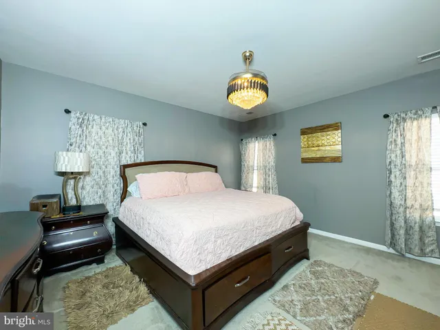 a bed room with a bed and a lamp