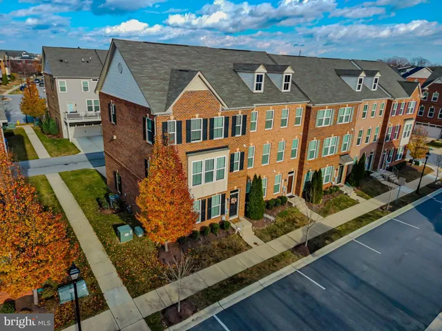 a front view of a house with large windows