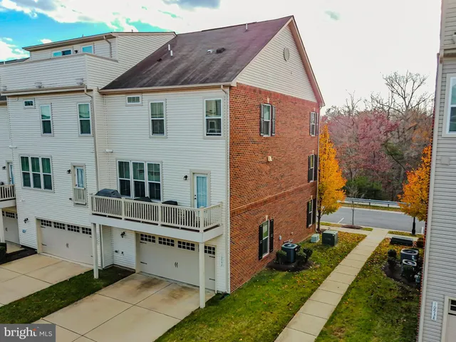 a view of house with backyard