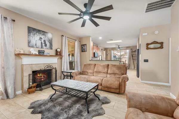 a living room with furniture and a fireplace