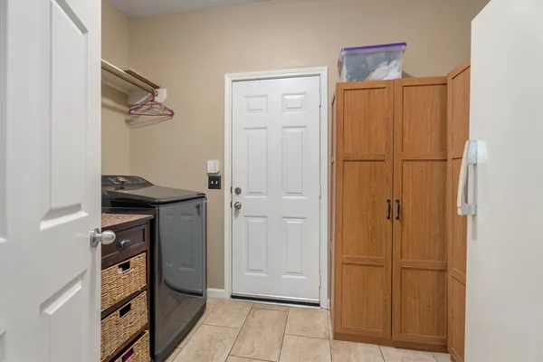 a view of a hallway to rooms and stairs