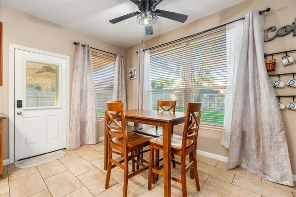a dining room with furniture and window