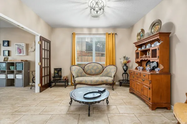 a living room with furniture and a large window