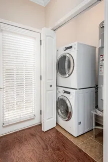 a view of a bedroom with washer and dryer