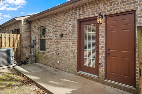 a view of a brick house with a door
