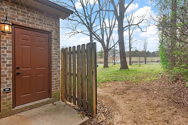 a view of a backyard with pathway