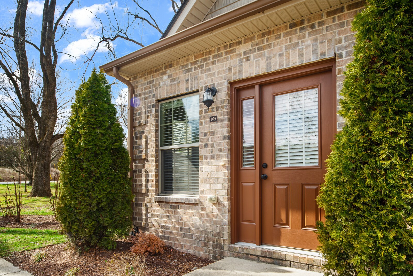 105 Velena Street Franklin, TN 37064 - Photo 4 of 31 a view of a brick house with a large windows