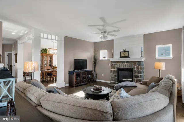 a bedroom with a bed and large windows