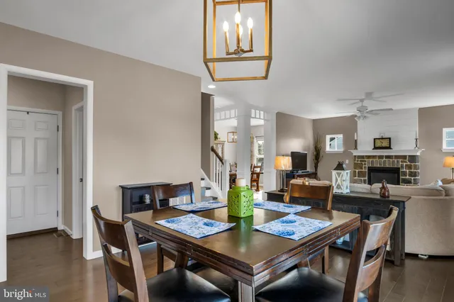 a view of a house with a yard and sitting area