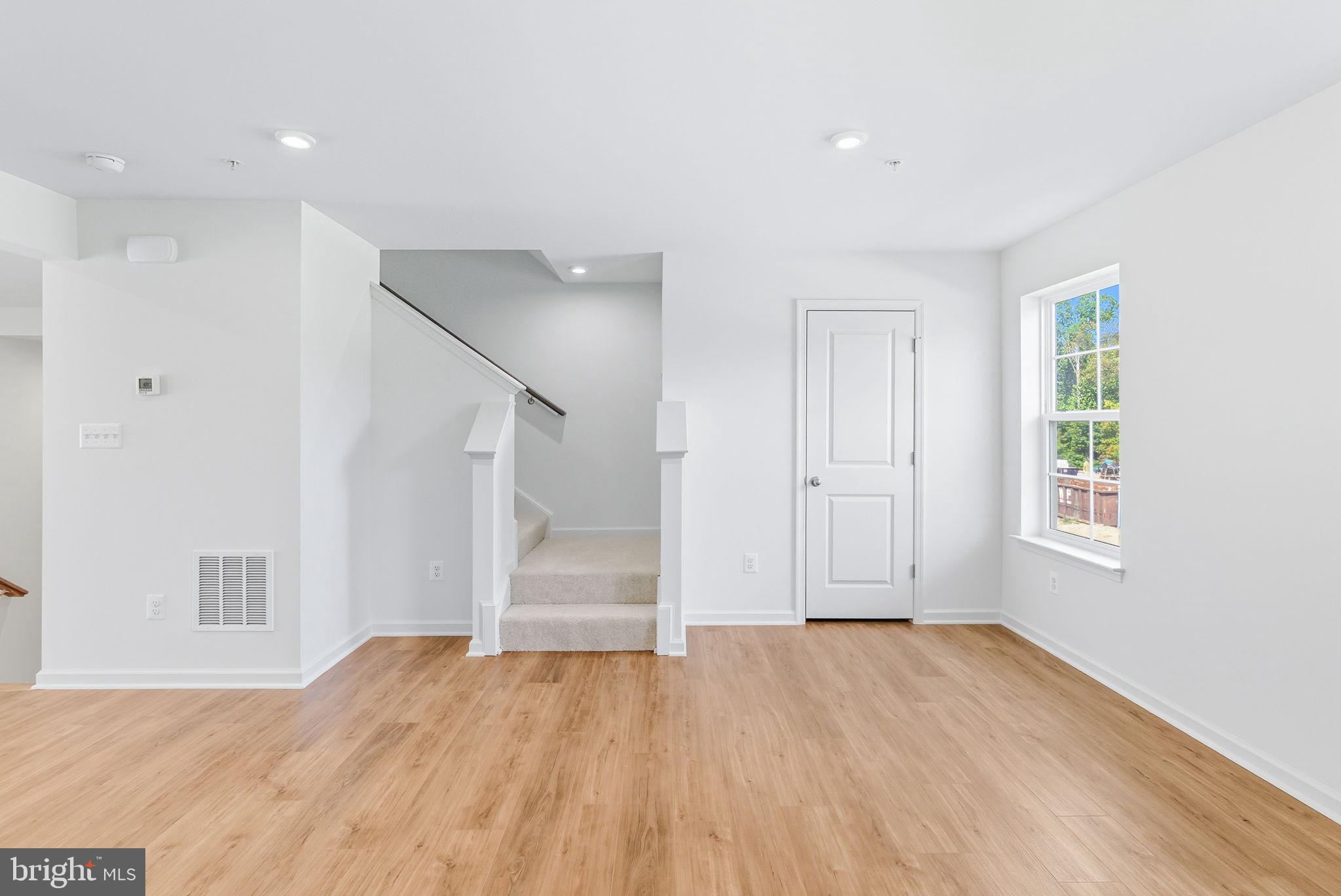 151 Homestead Drive Hanover, PA 17331 - Photo 13 of 46 a view of empty room with wooden floor and fan