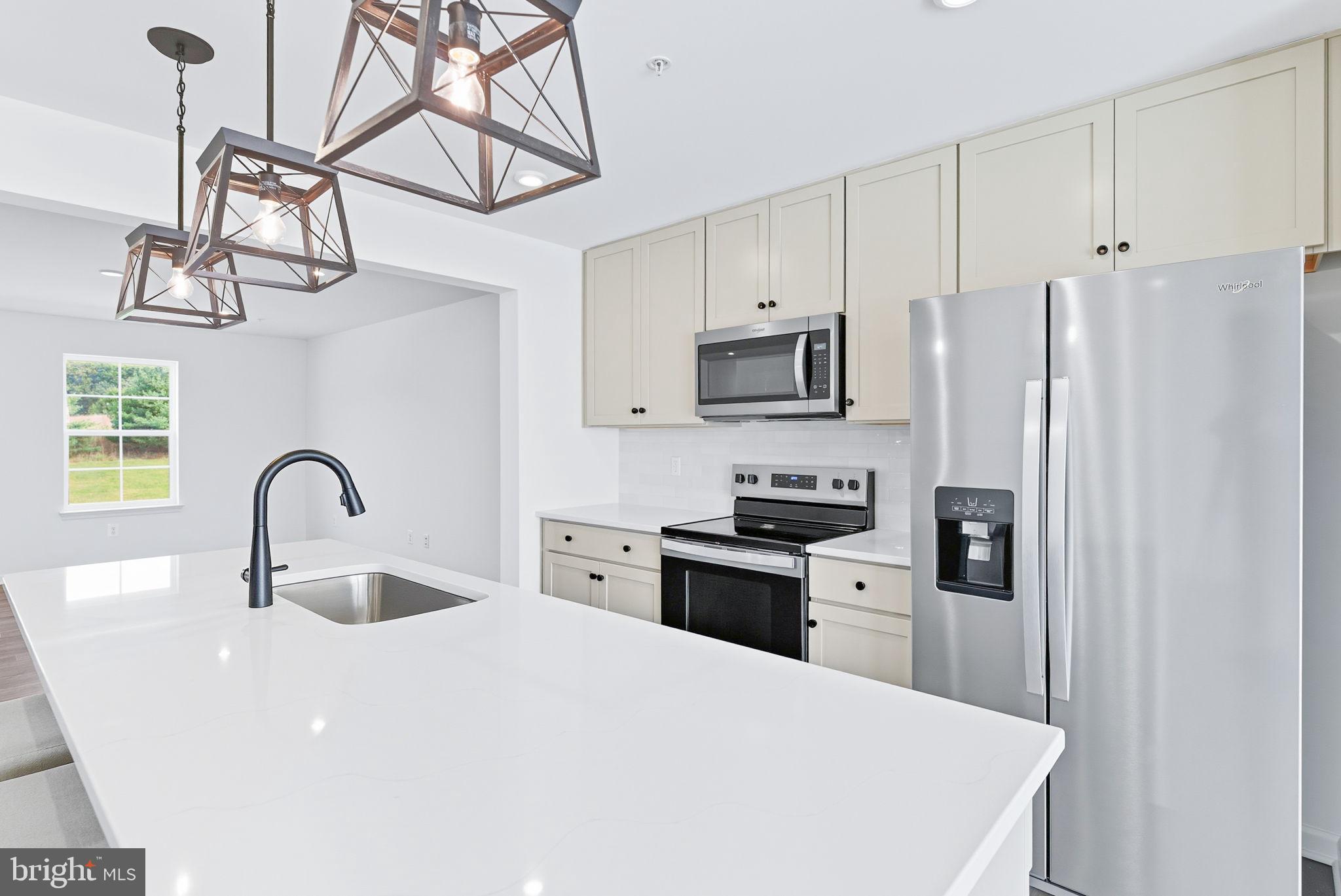 151 Homestead Drive Hanover, PA 17331 - Photo 3 of 46 a kitchen with stainless steel appliances a refrigerator a sink a stove and cabinets