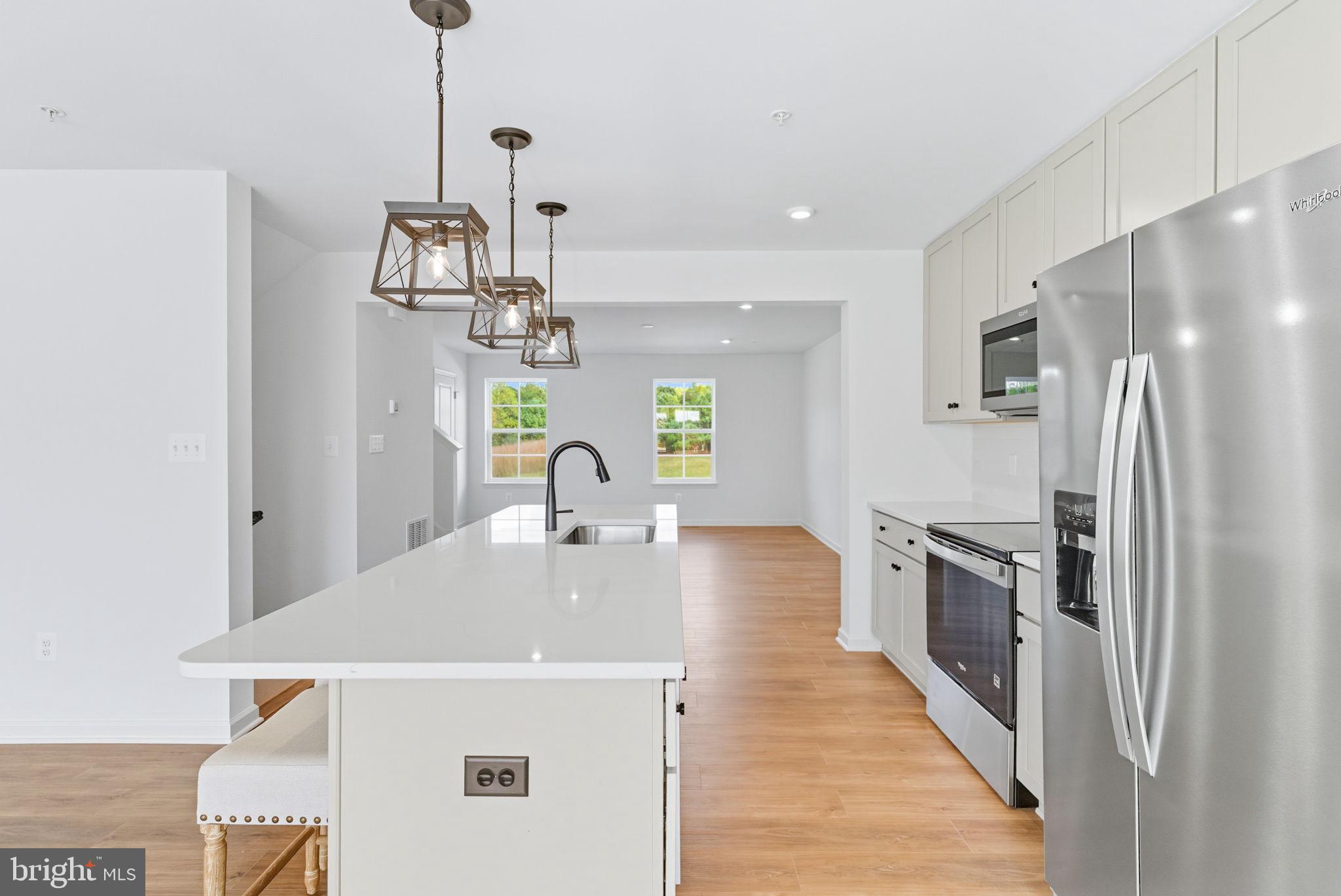 151 Homestead Drive Hanover, PA 17331 - Photo 6 of 46 a kitchen with stainless steel appliances a kitchen island a stove and a refrigerator