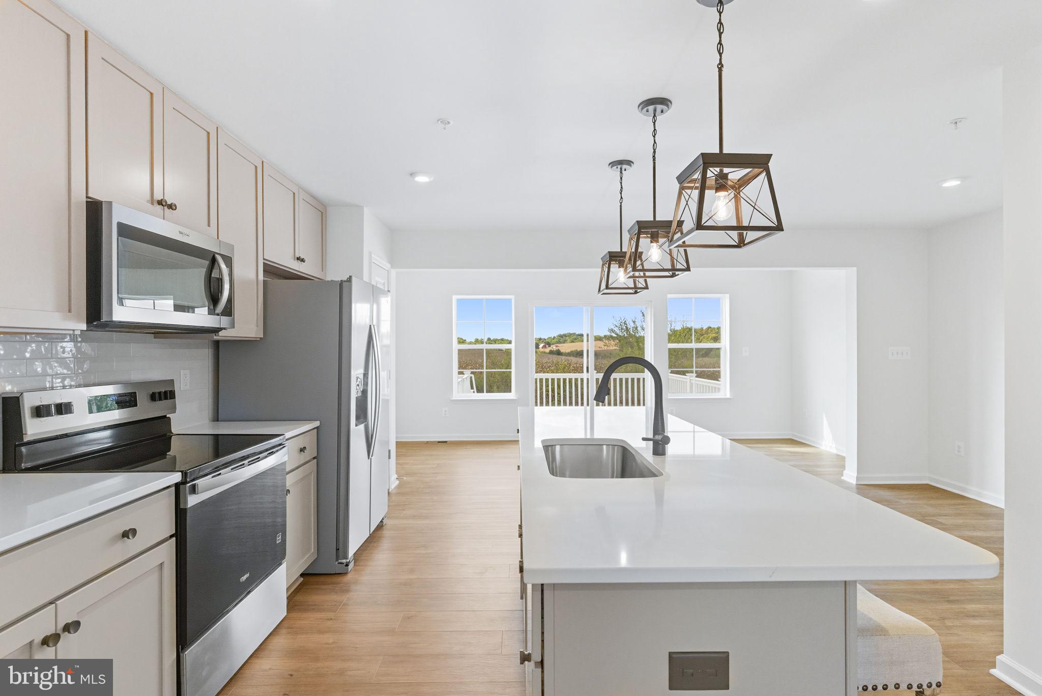 151 Homestead Drive Hanover, PA 17331 - Photo 8 of 46 a kitchen with stainless steel appliances granite countertop a sink a stove top oven a counter space and cabinets