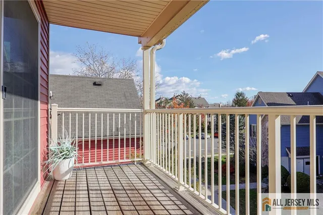 a view of a balcony with wooden floor