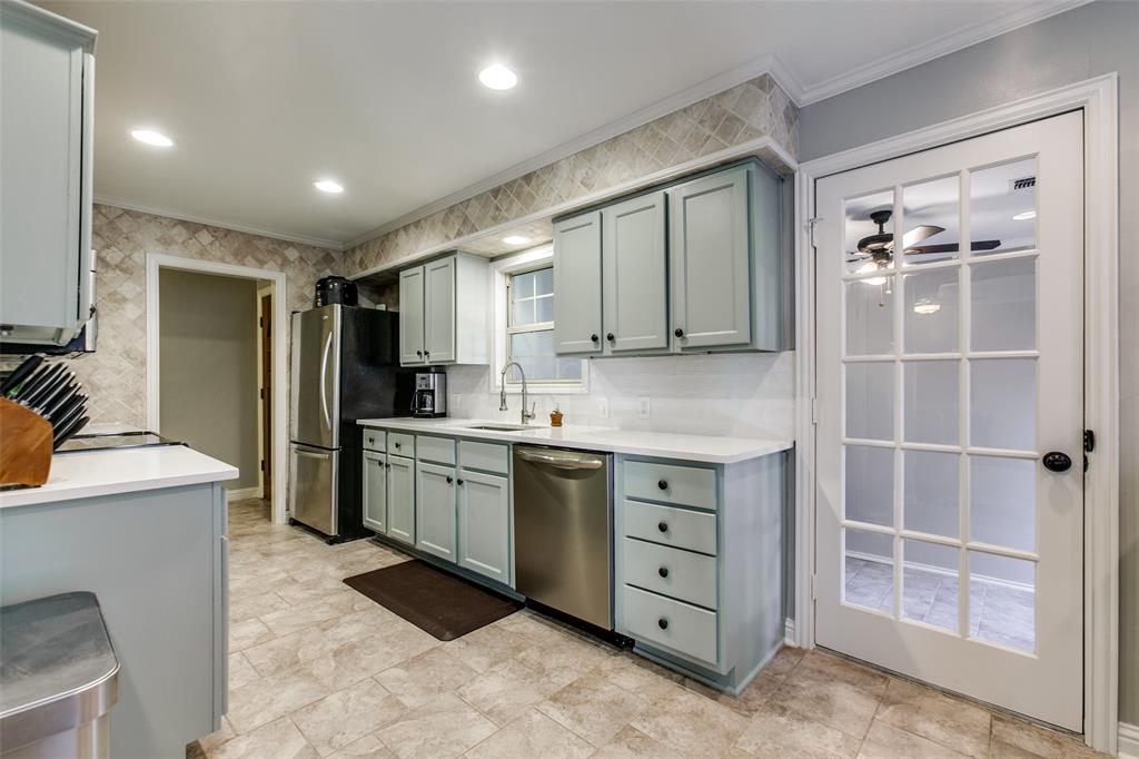 a kitchen with a cabinets and a stove top oven