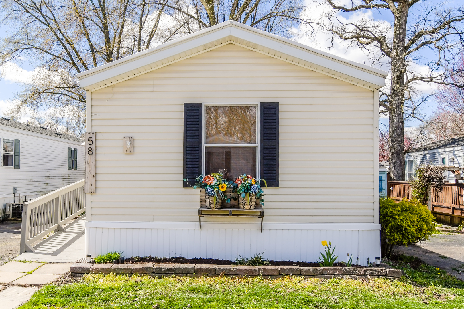 a front view of a house with garden