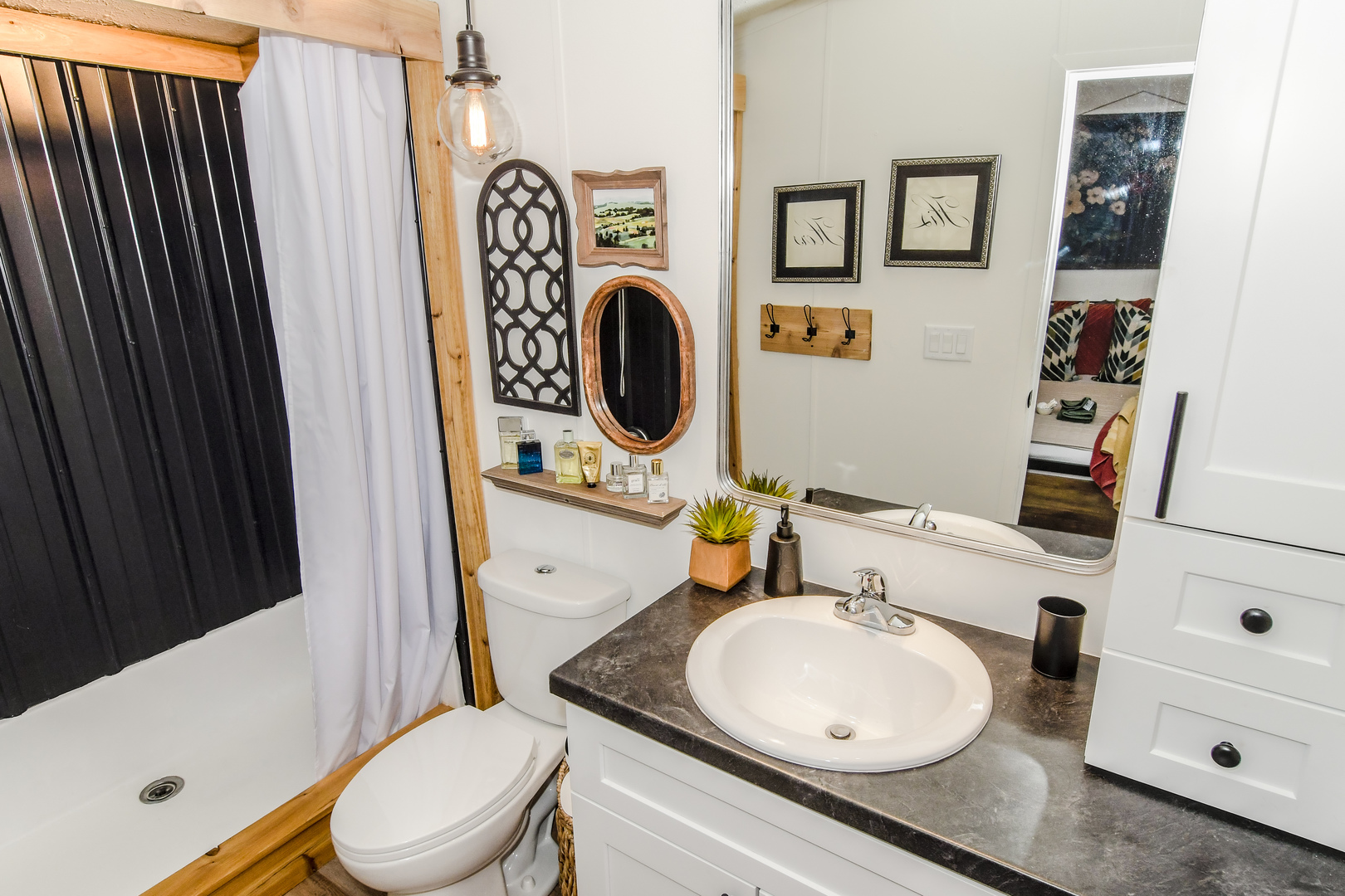 58 Oak Street Minooka, IL 60447 - Photo 20 of 28 a bathroom with a toilet a sink and a mirror
