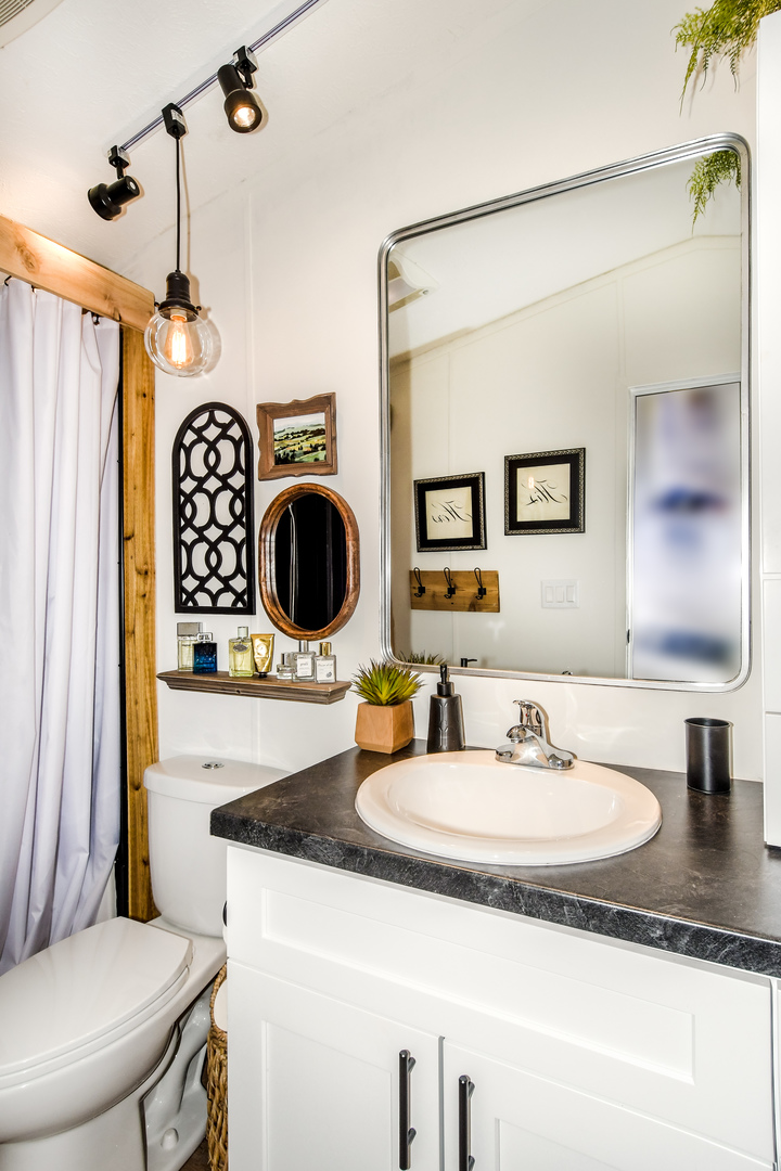 58 Oak Street Minooka, IL 60447 - Photo 21 of 28 a bathroom with a sink a toilet and a mirror