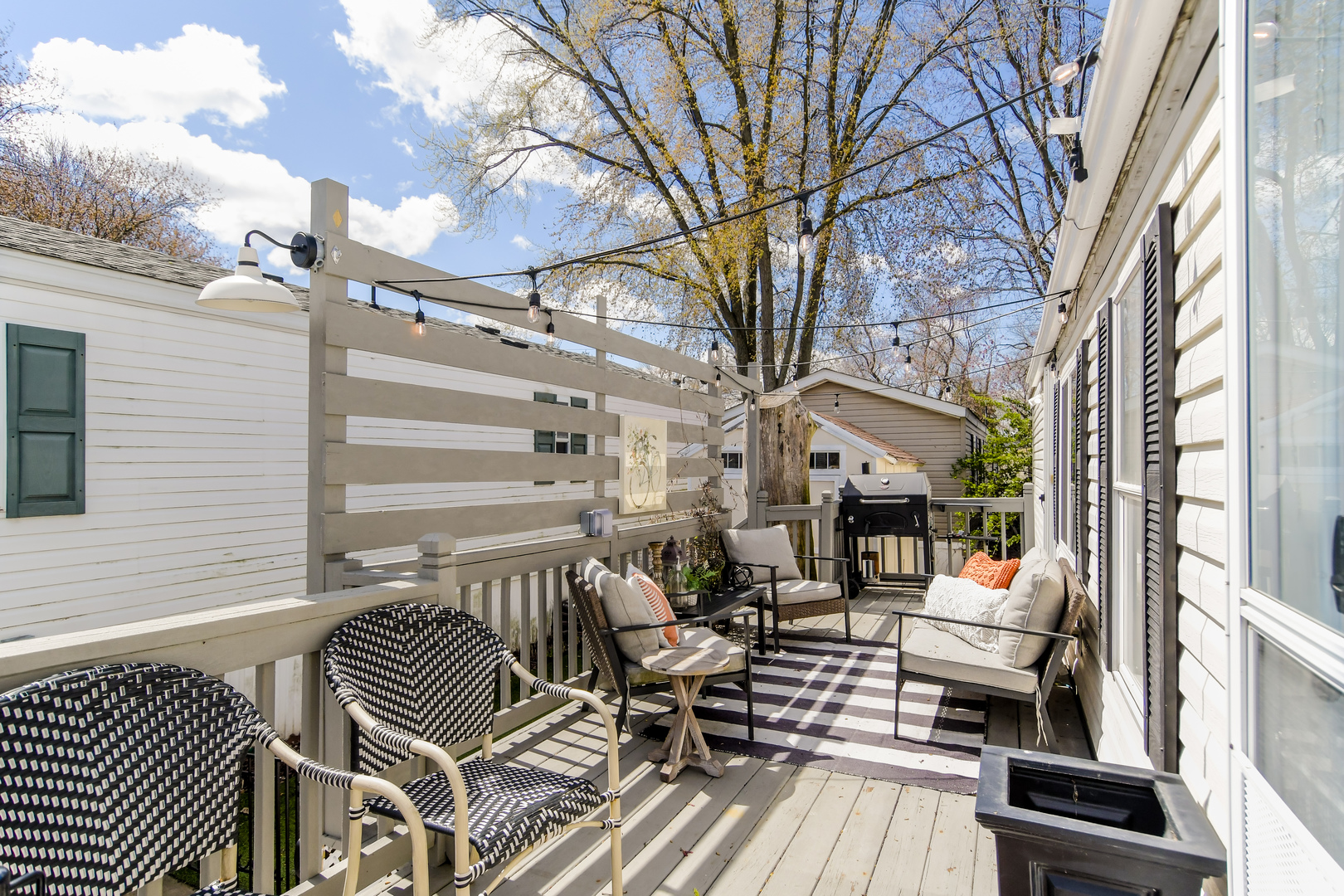 58 Oak Street Minooka, IL 60447 - Photo 23 of 28 a view of a patio with couches chairs and wooden floor