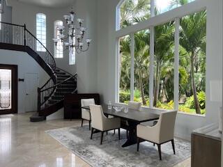 182 Rosalia Court Jupiter, FL 33478 - Photo 28 of 32 Dining and spiral staircase