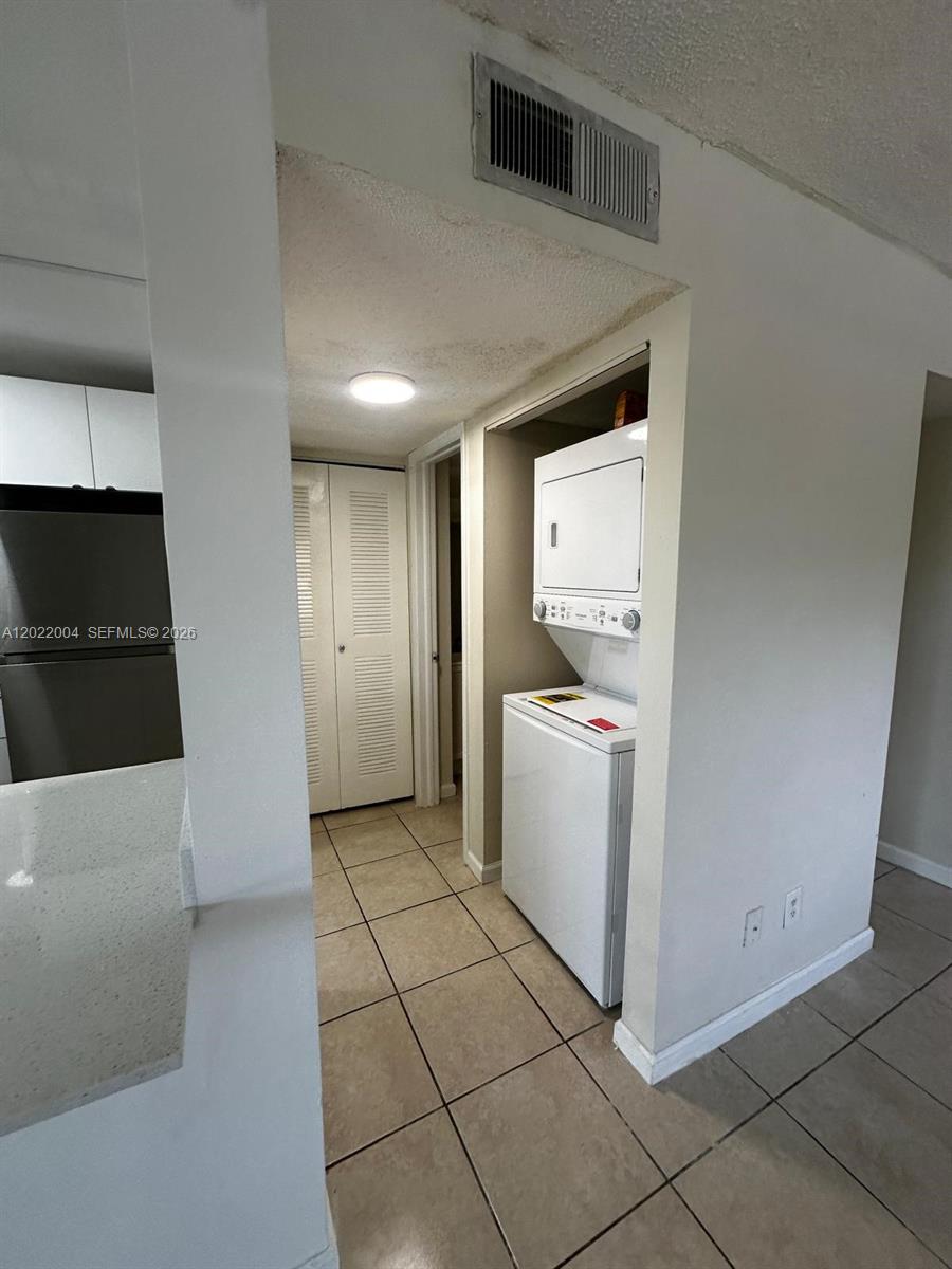 3400 Foxcroft Road, Unit 301 Miramar, FL 33025 - Photo 19 of 72 a utility room with dryer and washer