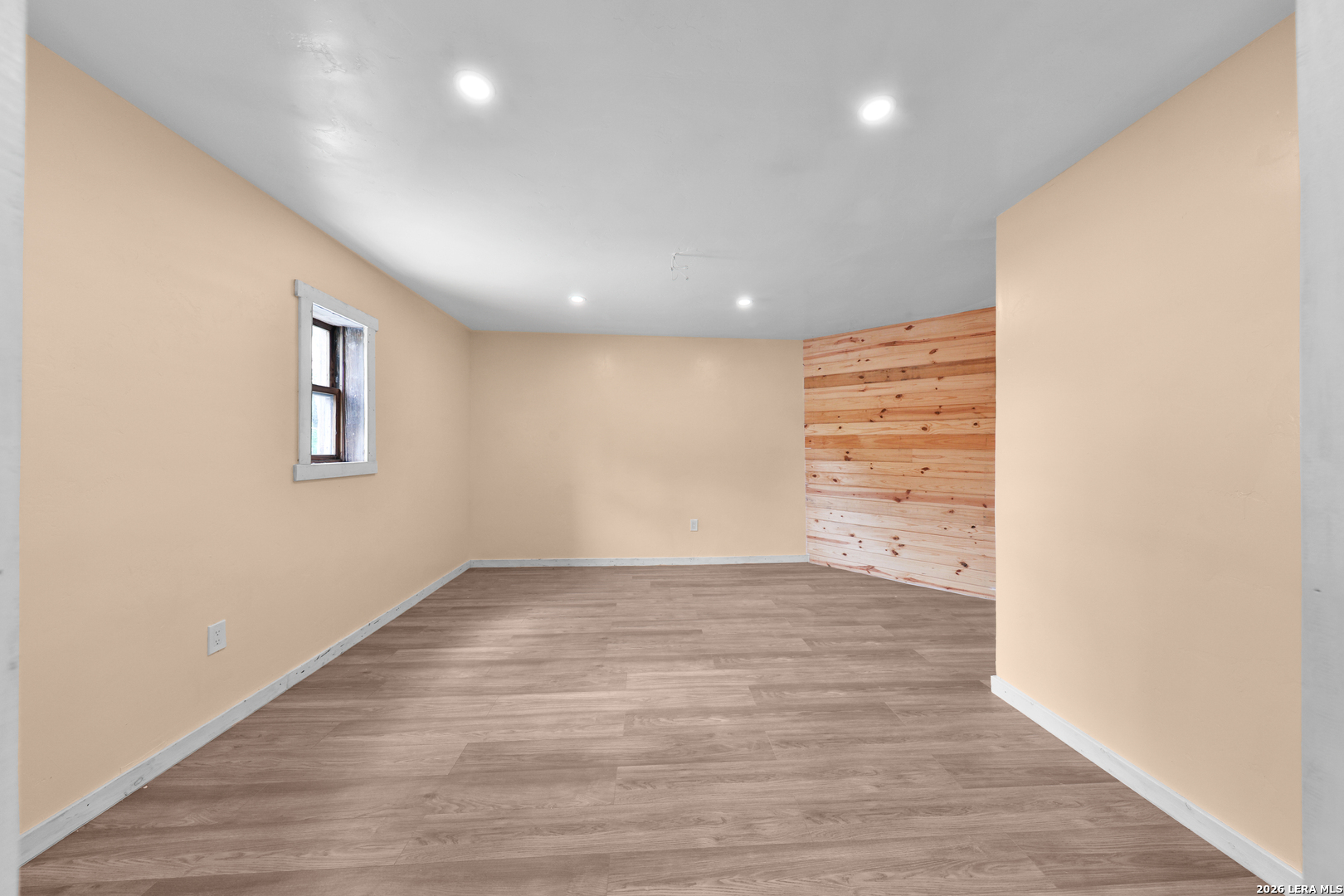 122 Brink Center Point, TX 78010 - Photo 28 of 40 an empty room with wooden floor and windows