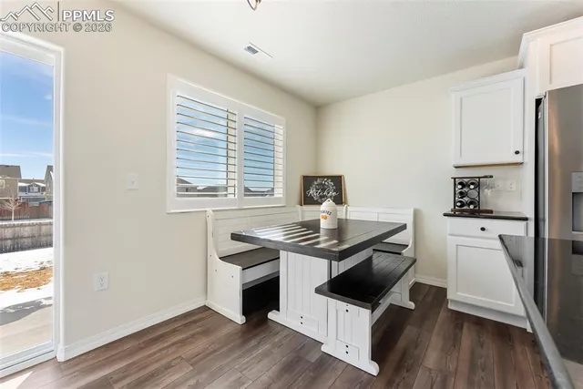 a kitchen with stainless steel appliances granite countertop a stove a refrigerator and a microwave