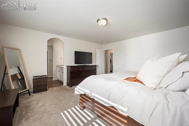 a bedroom with a bed and furniture