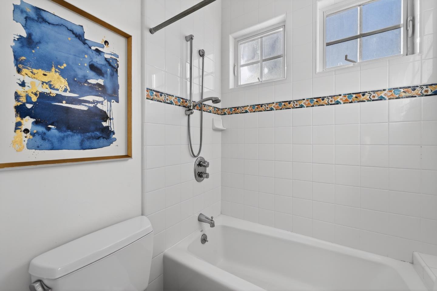 17599 Montebello Road Cupertino, CA 95014 - Photo 40 of 83 a bathroom with a shower and a toilet