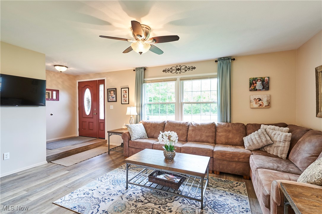 6214 Renninger Road Akron, OH 44319 - Photo 3 of 27 Living area with ceiling fan, and LVT flooring