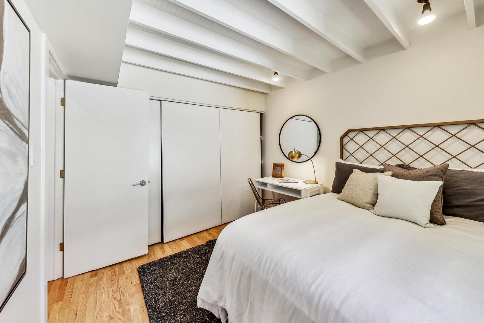 1009 West Wolfram Street, Unit 2W Chicago, IL 60657 - Photo 12 of 24 a bedroom with bed and a closet