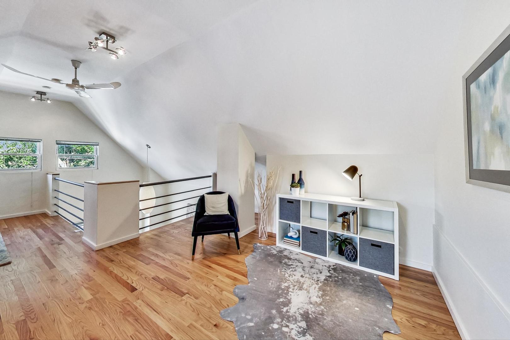 1009 West Wolfram Street, Unit 2W Chicago, IL 60657 - Photo 16 of 24 a view of a livingroom with furniture and hardwood floor