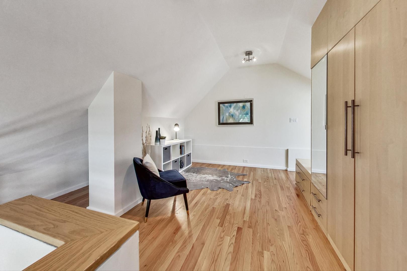 1009 West Wolfram Street, Unit 2W Chicago, IL 60657 - Photo 18 of 24 a view of a livingroom with furniture and wooden floor