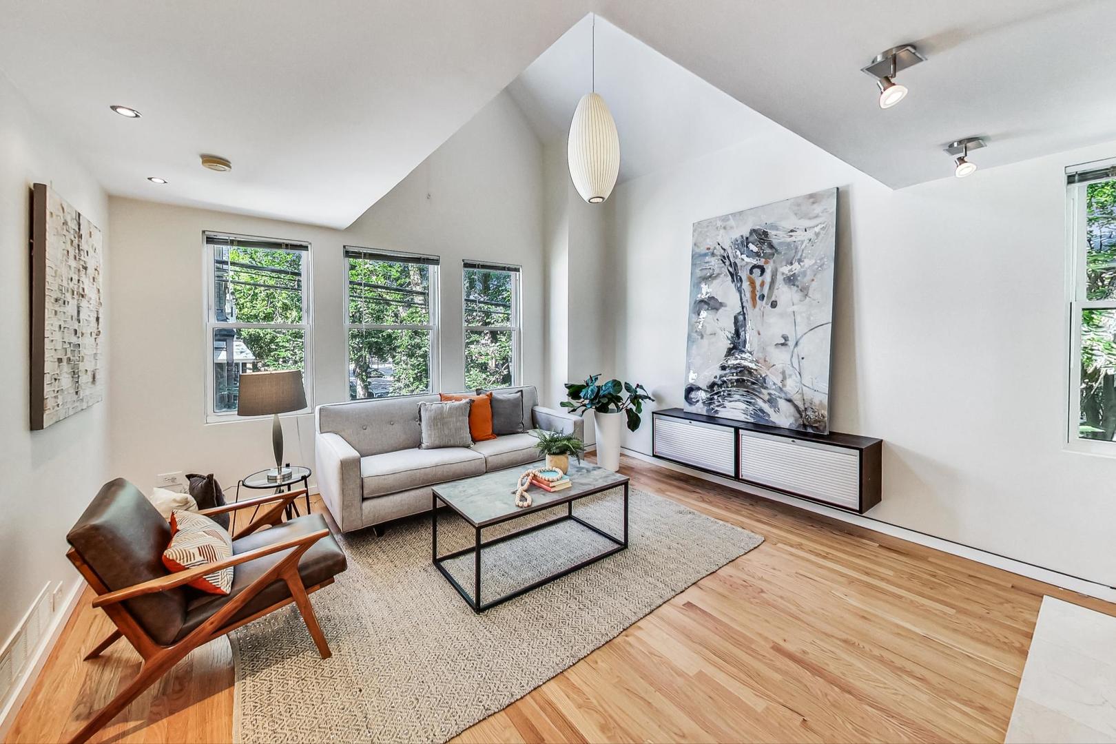 1009 West Wolfram Street, Unit 2W Chicago, IL 60657 - Photo 4 of 24 a living room with furniture and a window