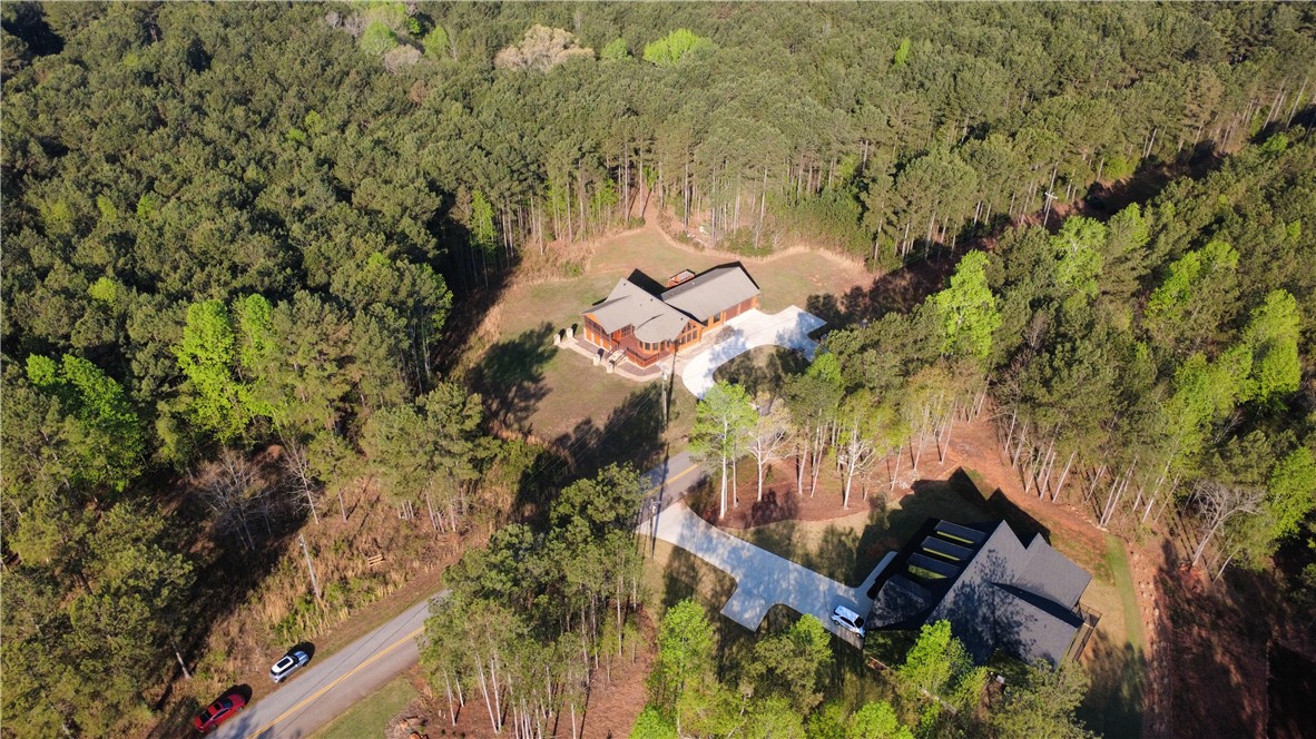 128 McAlister Road West Union, SC 29696 - Photo 34 of 40 Perched amidst a verdant forest, a secluded residence offers tranquility and privacy.