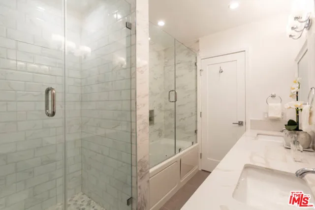 a bathroom with a bathtub and a shower