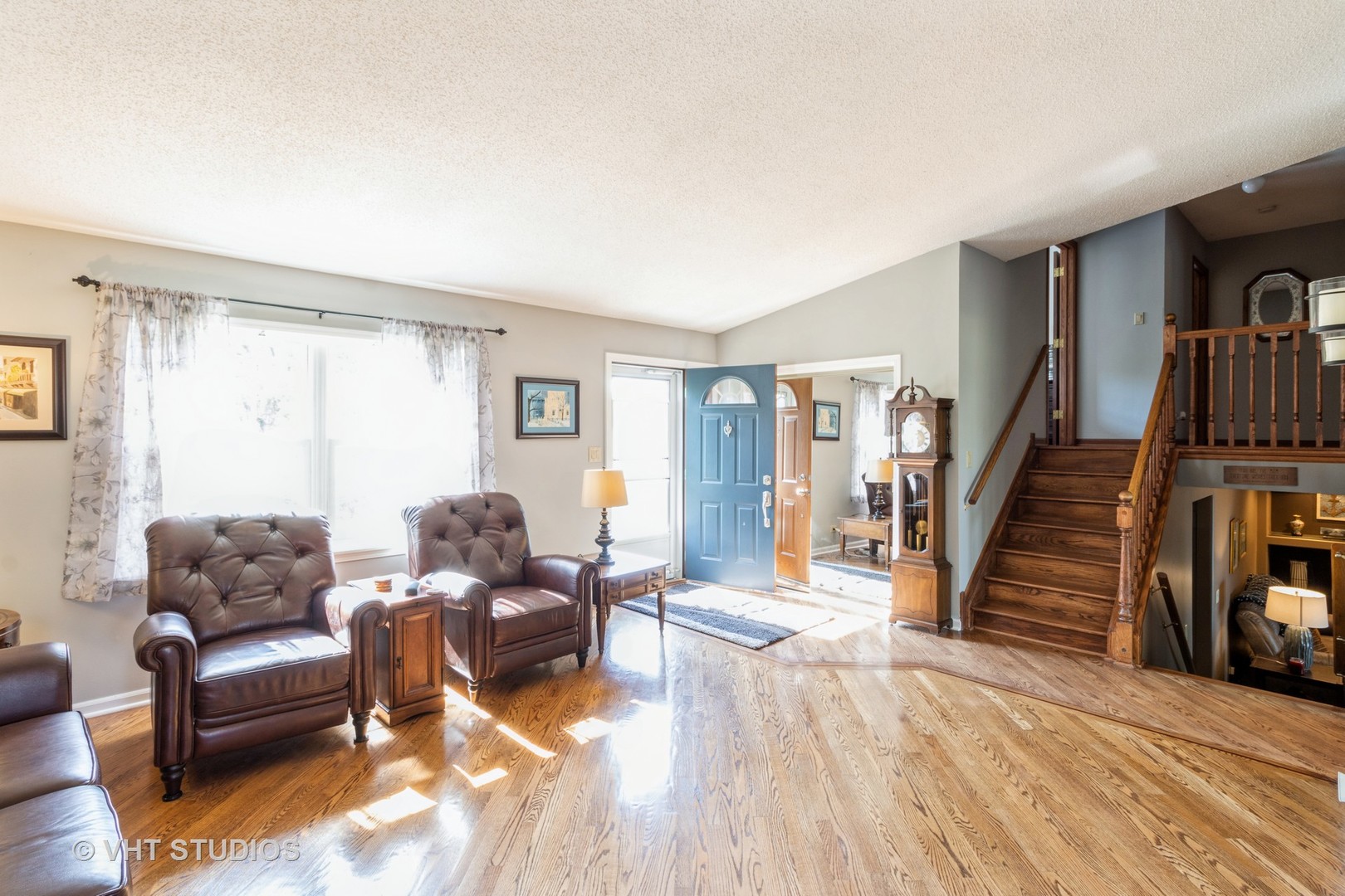 1061 Warwick Circle North Hoffman Estates, IL 60169 - Photo 4 of 18 a living room with furniture and wooden floor