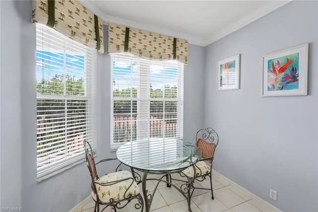 a view of a room with furniture and windows