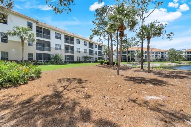 a view of a building with a yard