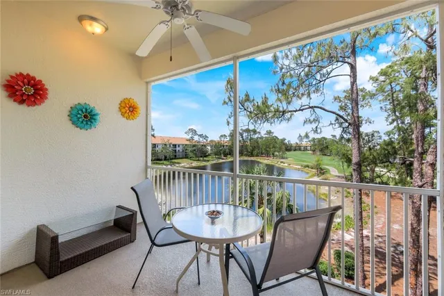 a view of a chairs and table in the balcony