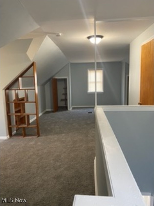 13206 Rockside Road Garfield Heights, OH 44125 - Photo 10 of 15 Corridor with dark carpet and lofted ceiling