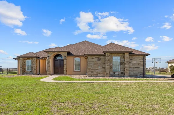a front view of a house with a yard