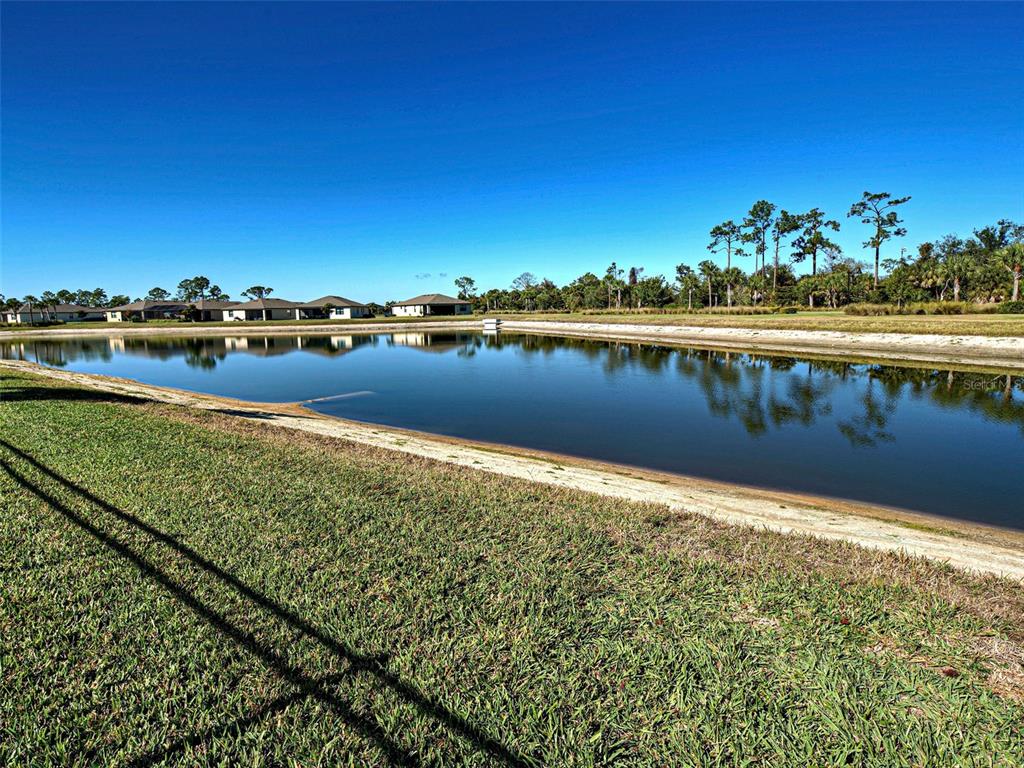 1824 East Isles Rd Port Port Charlotte, FL 33953 - Photo 11 of 80 a view of a lake with outdoor space