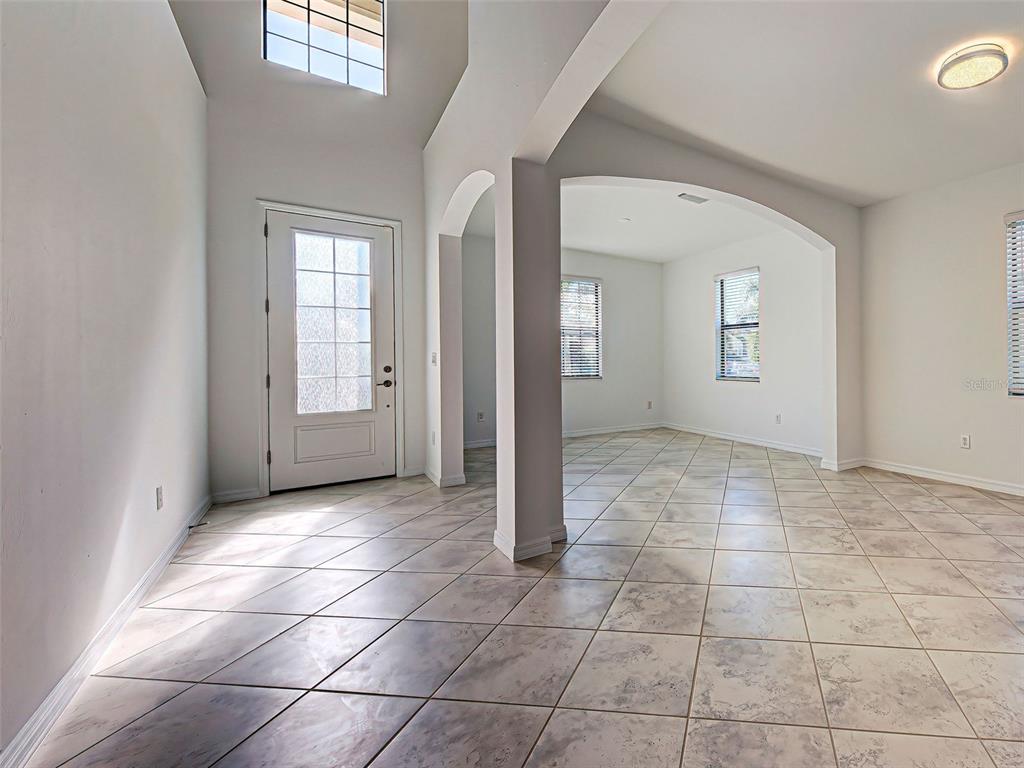 1824 East Isles Rd Port Port Charlotte, FL 33953 - Photo 14 of 80 an empty room with a empty space and windows