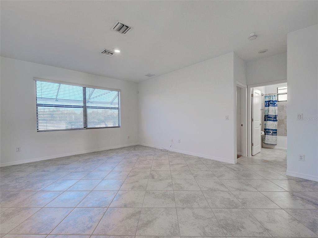 1824 East Isles Rd Port Port Charlotte, FL 33953 - Photo 28 of 80 an empty room with a empty space and windows