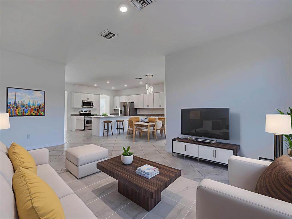 1824 East Isles Rd Port Port Charlotte, FL 33953 - Photo 32 of 80 a living room with furniture and a flat screen tv
