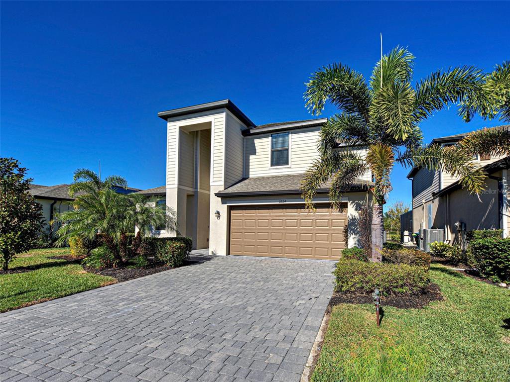 1824 East Isles Rd Port Port Charlotte, FL 33953 - Photo 4 of 80 a front view of a house with a yard