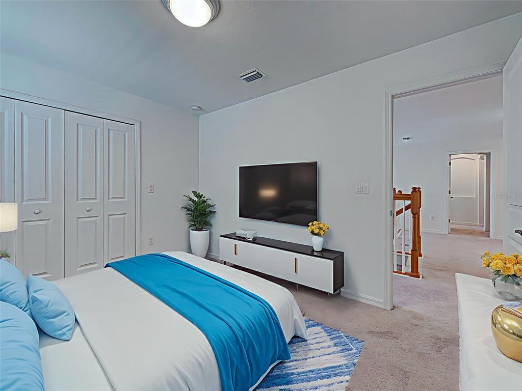 1824 East Isles Rd Port Port Charlotte, FL 33953 - Photo 59 of 80 a bedroom with a bed and a flat screen tv