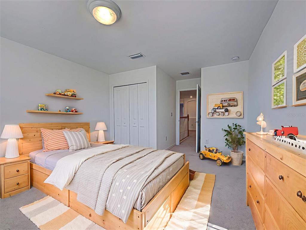 1824 East Isles Rd Port Port Charlotte, FL 33953 - Photo 61 of 80 a bedroom with a bed and a dresser
