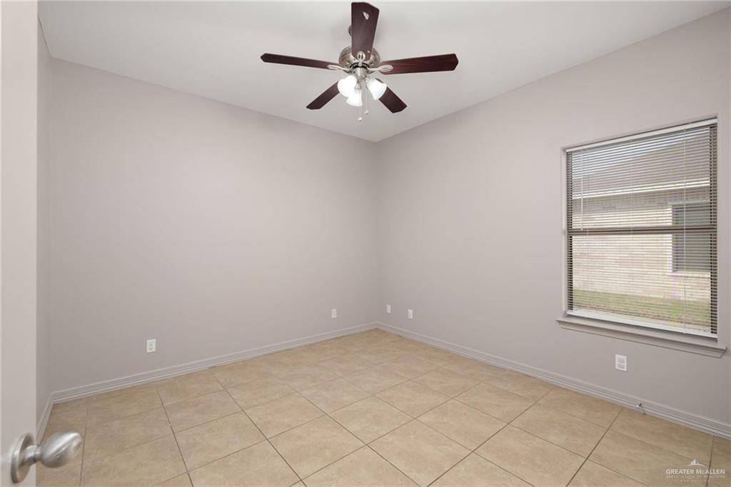 1214 Cornerstone Loop Rio Grande City, TX 78582 - Photo 6 of 15 an empty room with windows and fan